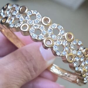Gold Tone Open Clasp Bracelet with Circle Designs and Sparkling Crystals